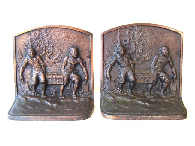 A pair of 'Pirates carrying a treasure chest' made by Hubley Mfg. circa 1925